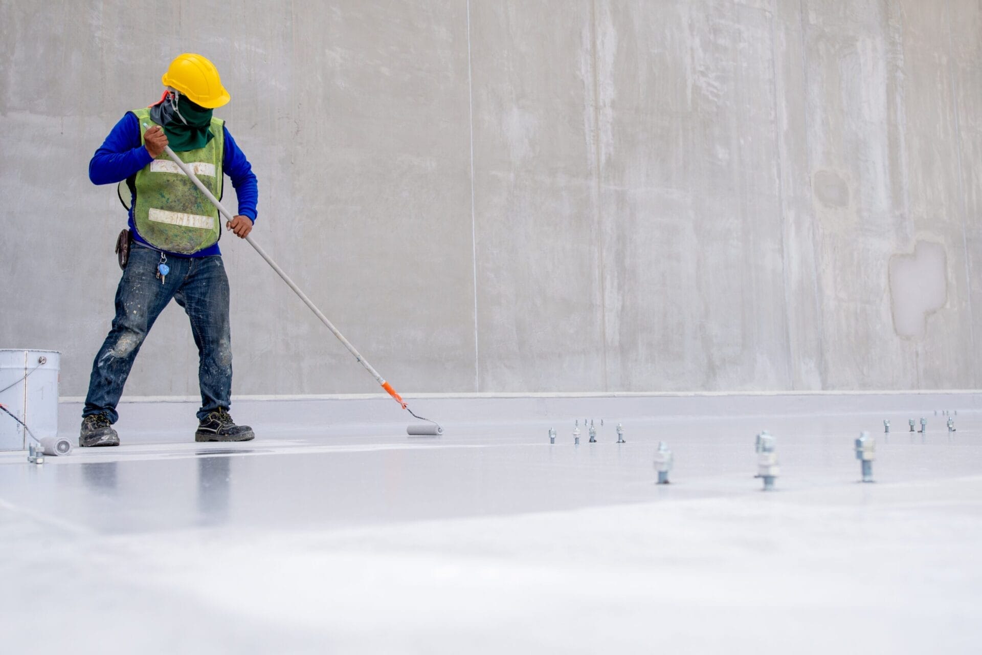 Construction,Worker,Coating,Floor,By,Epoxy shutterstock 1285733716 scaled