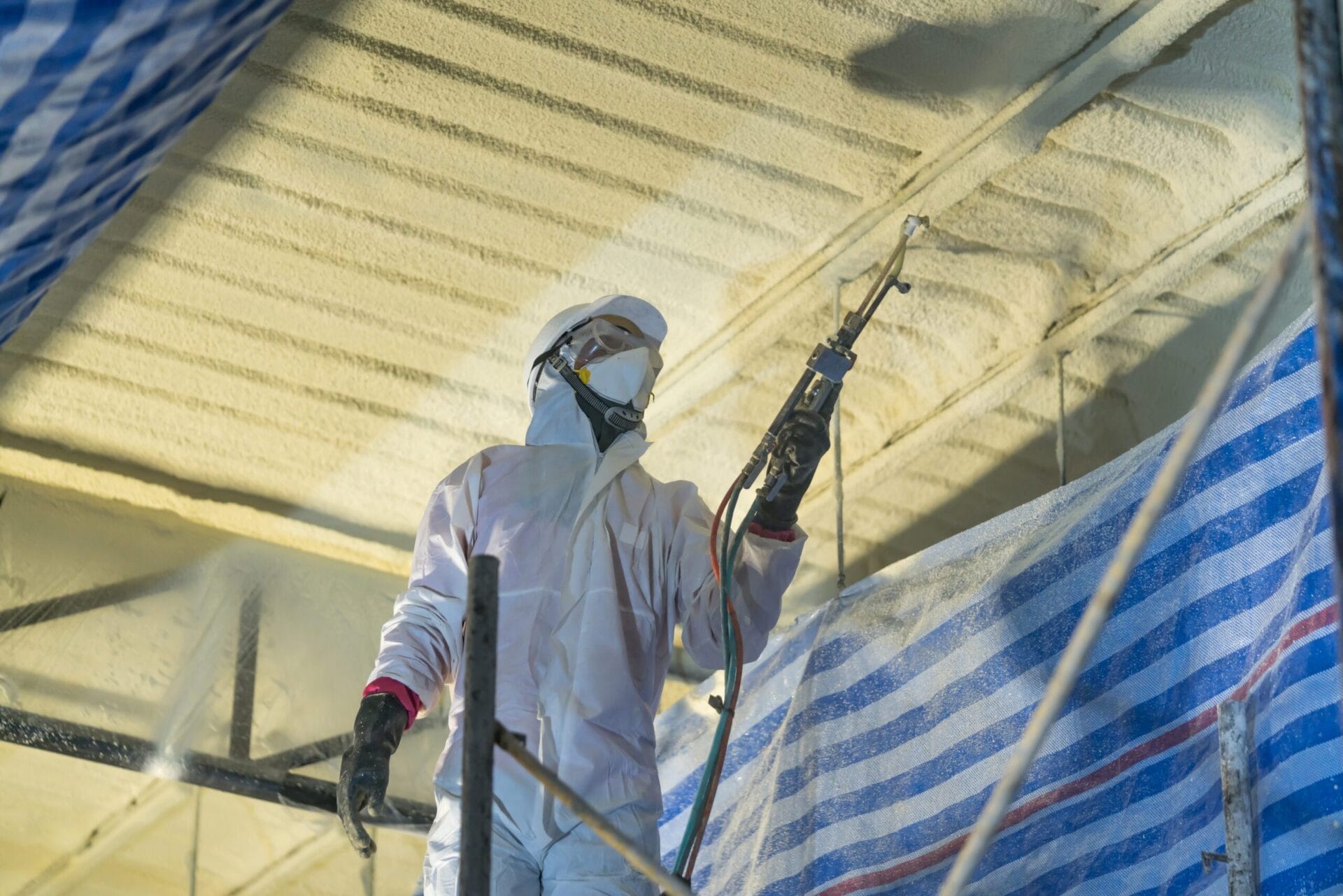 Technician,Spraying,Foam,Insulation,Using,Plural,Component,Gun,For,Polyurethane shutterstock 739798558 2 scaled